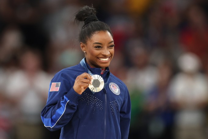 PARIS, FRANCE - AUGUST 05: Silver medalist Simone Biles of Team United States poses on the podium at the Artistic Gymnastics Women's Floor Exercise Medal Ceremony on day ten of the Olympic Games Paris 2024 at Bercy Arena on August 05, 2024 in Paris, France. (Photo by Jamie Squire/Getty Images)