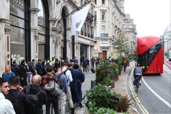 LONDON, ENGLAND - SEPTEMBER 20: Customers line-up outside the Apple Store, Regent Street on September 20, 2024 in London, England. Following Apple's new product announcements, customers can pick up the new iPhone 16, 16 Plus, 16 Pro and 16 Pro Max, Apple Watch Series 10, AirPods 4, AirPods Pro 2 and AirPods Max from UK Apple Stores today.