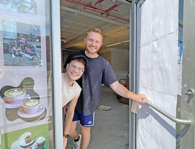 Staff Photo by Jennifer McNally / Sleepyhead Coffee owners Christian Harris, left, and Brandon Carruth are pictured Thursday in the entrance of their new location on East Main Street in Chattanooga.