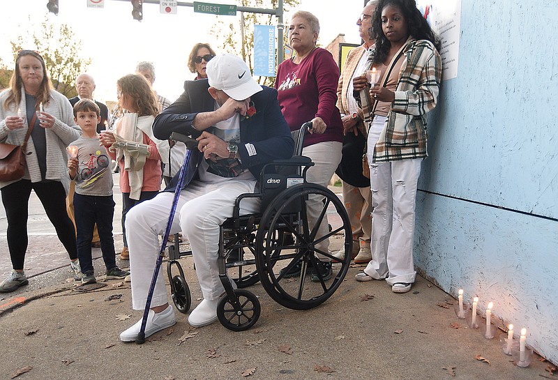 Staff photo by Matt Hamilton/  Octavio Devia Paz, middle, sits quietly during a vigil for the Devia Paz family on Frazier Ave. on Saturday, November 16, 2024.