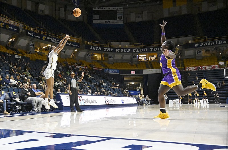 Staff photo by Abby White / UTC's Ava Card, left, follows through on a 3-point shot during a game against Tennessee Tech on Nov. 7 at McKenzie Arena.