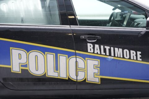 Man shown on video beating up 2 men after Commanders-Ravens game turns himself in to police