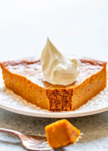 Crustless Pumpkin Pie - The EASIEST pumpkin pie you'll ever make because there's no crust!! One bowl, no mixer, and the pie is PERFECTLY flavored with plenty of pumpkin spice and everything nice! Put this pie on your holiday menu!!