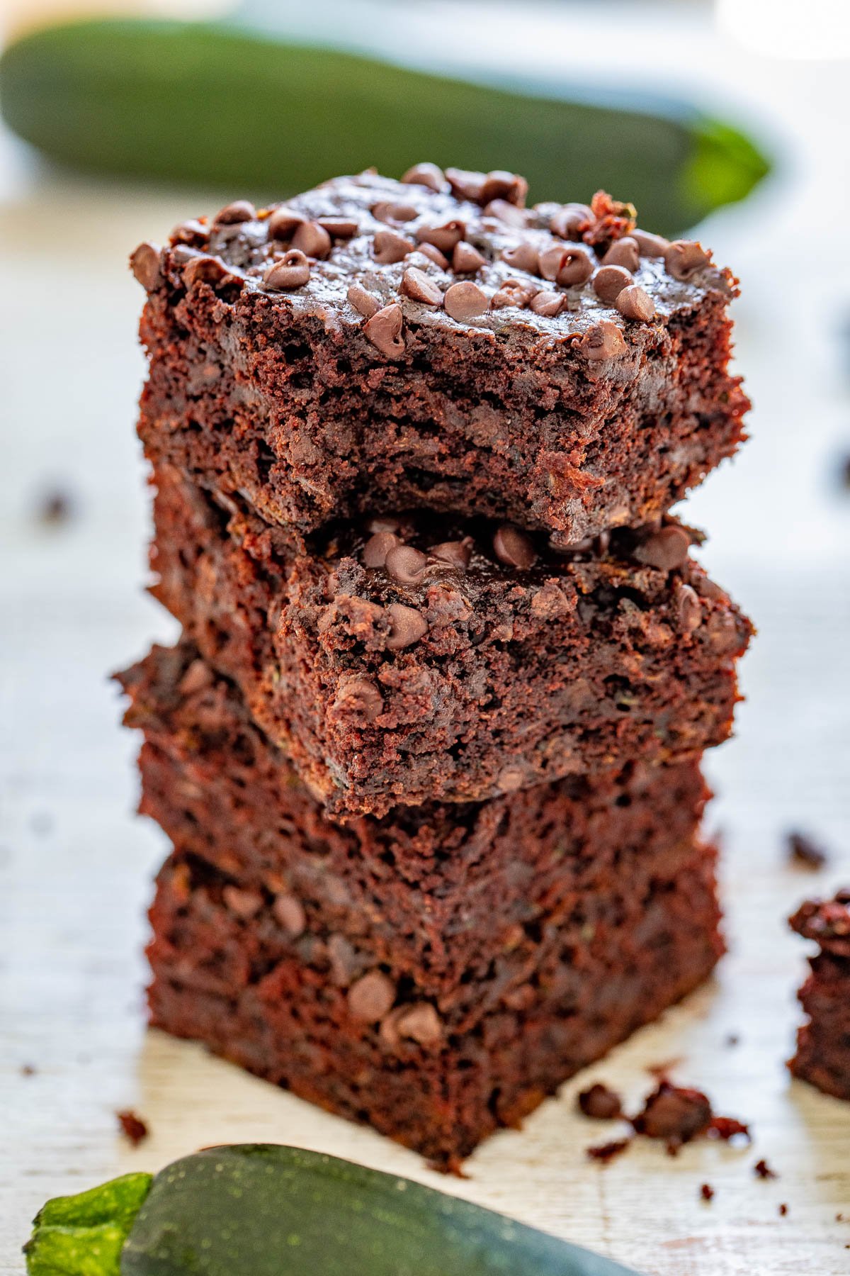 Zucchini Brownies - The BEST zucchini brownies that are EASY, made in one bowl, and no mixer required! Soft, fudgy, and almost taste like rich chocolate cake. They're filled and topped with mini chocolate chips to add even more fabulous chocolate flavor. And NO, you cannot taste the zucchini at all - promise! 