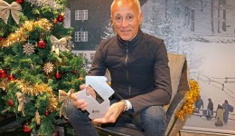 WHAM!’s Andrew Ridgeley with his Official Christmas Number 1 award 2024 from the Official Charts Company.