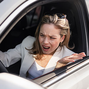 “Ma’am I Live Here”: Woman Refuses To Back Out Of Driveway, Learns A Lesson The Hard Way