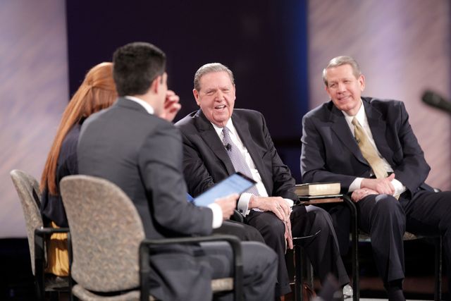 During the first Face to Face event held for young single adults of the Church, Elder Jeffrey R. Holland, and Elder Donald L. Hallstrom of the Presidency of the Seventy, visit with the young adult hosts, March 8, 2016.