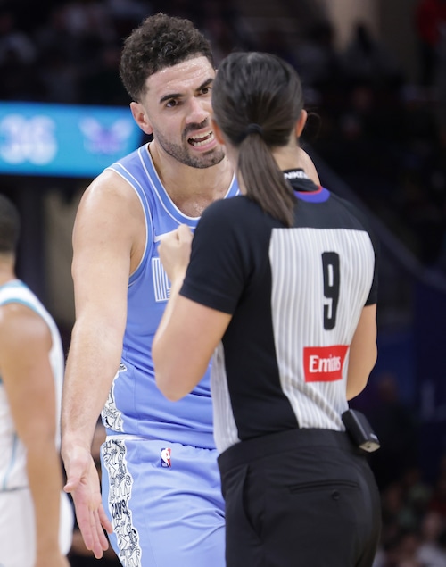 Cavaliers forward Georges Niang (20) argues a call