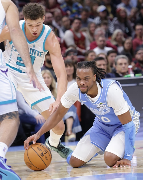 Cavaliers guard Darius Garland (10) almost loses the ball