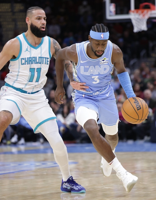 Cavaliers guard Caris LeVert (3) drives around Hornets forward Cody Martin