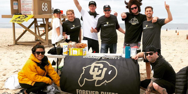 CU alumni group at a beach cleanup service event