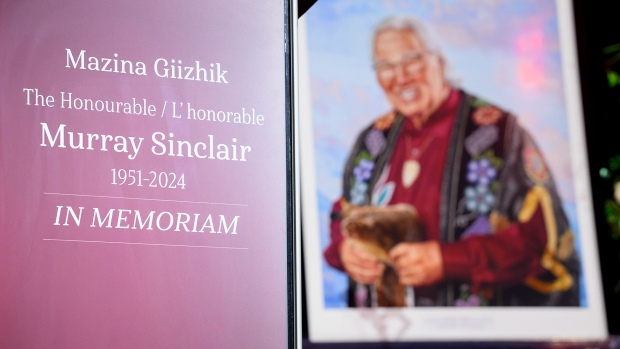 A framed portrait of Murray Sinclair sits on stage prior to a memorial service held in his honour in Winnipeg on Sunday, Nov. 10, 2024. A national commemorative ceremony took place for Murray Sinclair, a former judge, senator and chair of the Truth and Reconciliation Commission into residential schools. THE CANADIAN PRESS/Mike Sudoma
