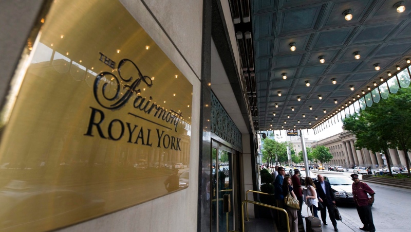 Doormen work at the Royal York Hotel in Toronto on Thursday, June 3, 2010. THE CANADIAN PRESS/Adrien Veczan