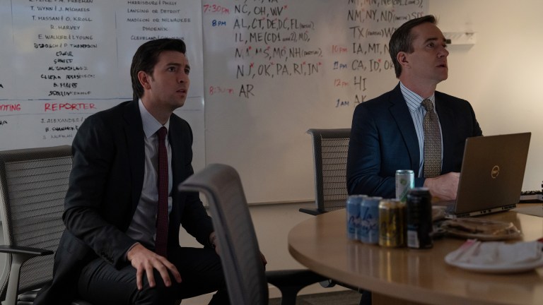 Greg (Nicholas Braun) and Tom (Matthew Macfadyen) sit at a conference room table on election night