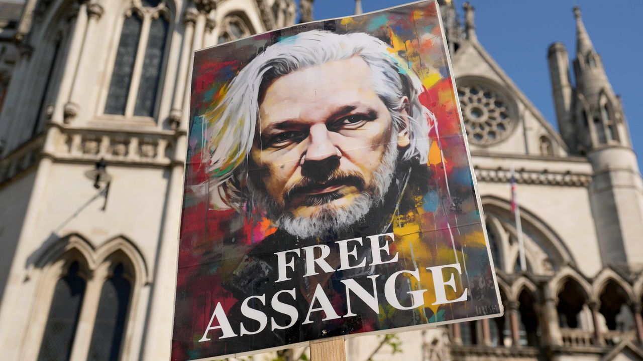 A placard with WikiLeaks founder Julian Assange reading 'Free Assange' outside the High Court in London, UK.