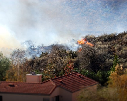 brushfire approaching a home