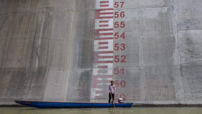 STUNG TRENG, CAMBODIA - MAY 7: Ota Khami, 55, stands where his home use to be before it was bulldozed to make way for the Sesan 2 dam, on May 7, 2015 in Stung Treng, Cambodia. Conservationists and politicians are warning the quest for hydropower is threatening the food supply of more than 40 million people in the Mekong basin. (Photo by Jason South/Fairfax Media/Getty Images)