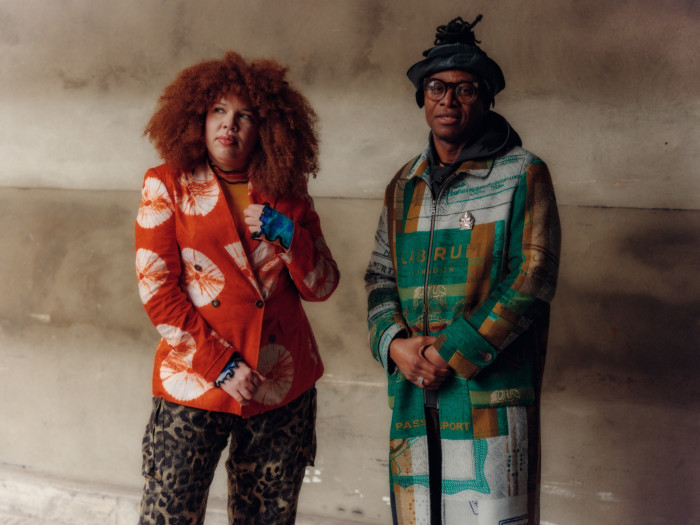 Ifore wears double-breasted twill blazer, £715, and leopard Freetown pants, £250. Dumbuya wears Maya Angelou Passport Overcoat, £1,300, and Freetown print tracksuit, POA (available in September). All by Labrum