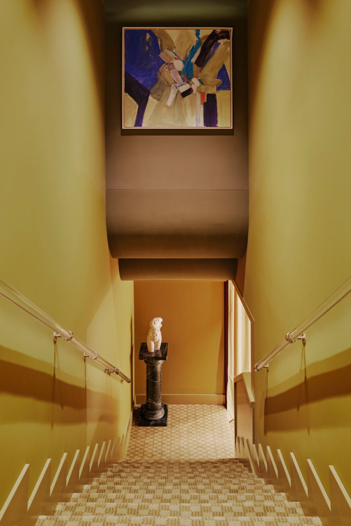 Designer Tatjana von Stein transformed this stairwell at Zurich’s Locke Hotel with a jolt of yellow and ombre stripes. A terracotta shade across the ceiling pulls the scheme together