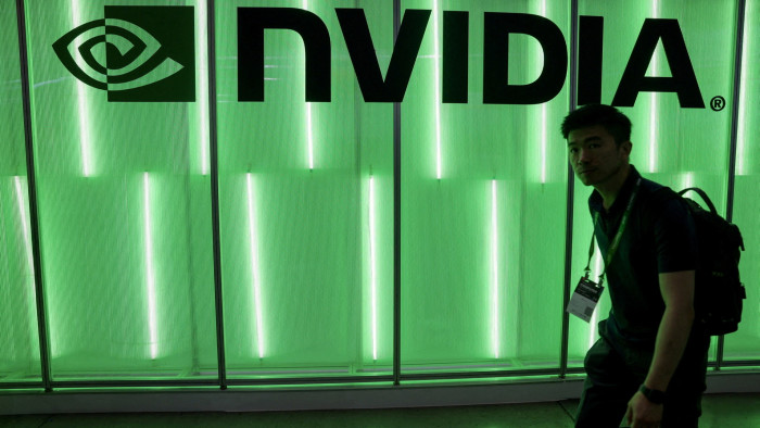 A person walks pass a Nvidia logo at Computex in Taipei, Taiwan