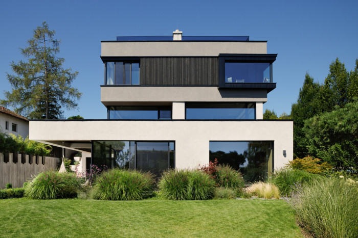 modernist house with big windows and lawn