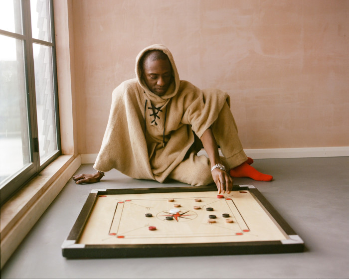 Adeyemi with his carrom board: ‘This is one of our favourite family games. It originates from India and was given to us as a gift. It brings out the cheater in everyone’