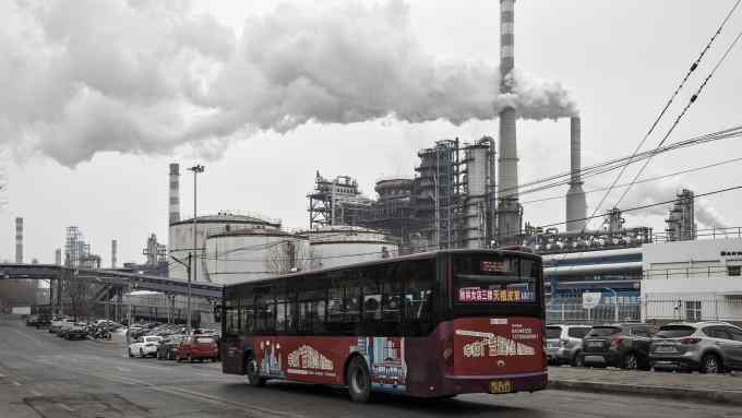 Smoke billows from the chimneys of a factory in Dalian, China