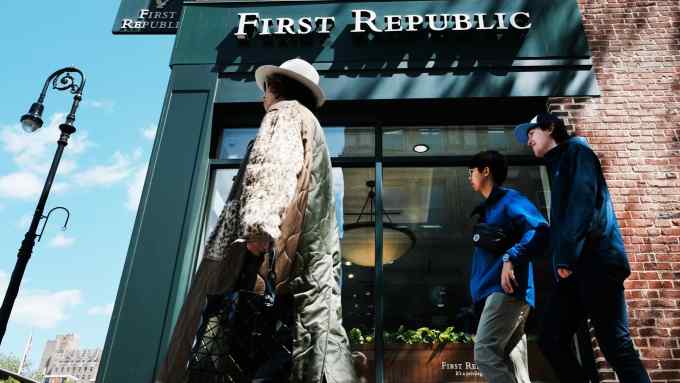 People walk past a First Republic bank branch in New York