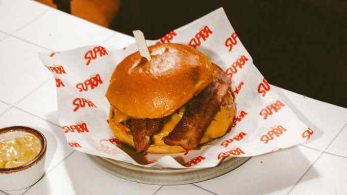 A bacon cheeseburger at the North London pop-up Supra Burger