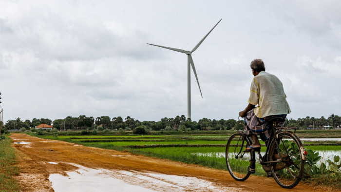 A wind turbine and a bicycle rider 