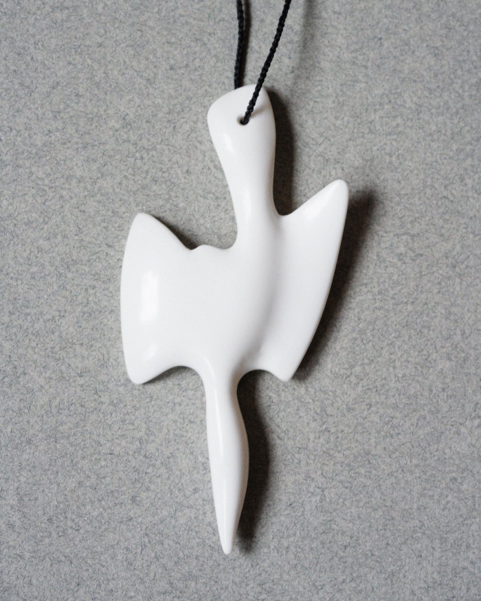 a pendant inspired by gannets diving into the sea 