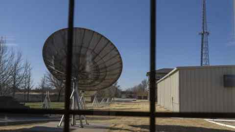 Large commercial satellite dish and a radio communications tower