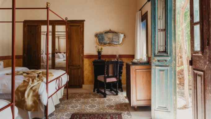 The twin bedroom of Villa Casbah Domes, one of the private villas at Al Moudira in Luxor