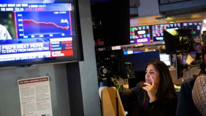 A trader on the floor of the New York Stock Exchange