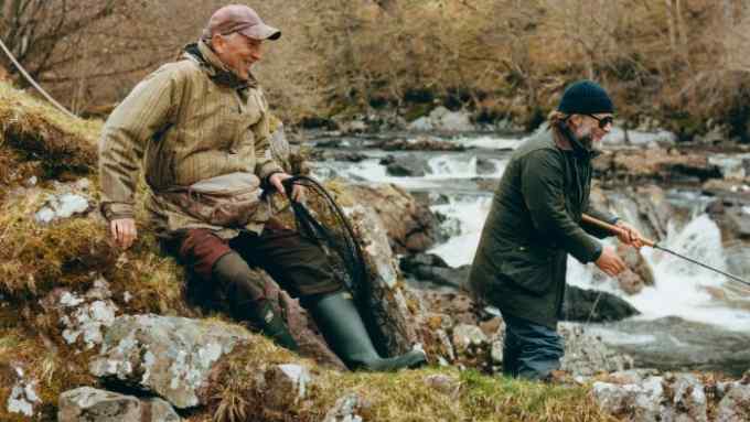 The author fishing on the River Carron with Jim the ghillie