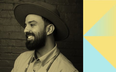 Black-and-white profile photograph of smiling bearded Nico Williams wearing a dark brimmed hat.