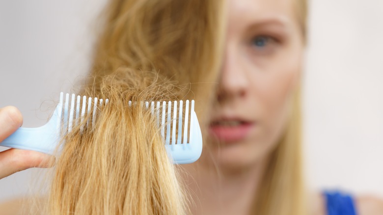 A woman combing her hair