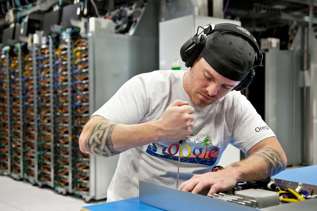 A worker swaps out a motherboard at our data center in The Dalles, Oregon.