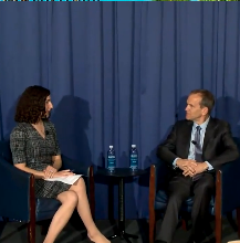 Kent Walker, President, Global Affairs & Chief Legal Officer, Google & Alphabet in conversation with Margaret Harding McGill, Technology Reporter, Axios, against a backdrop of a blue curtain