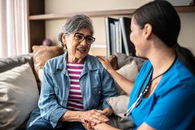 Woman talking to nurse