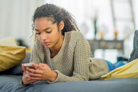 Teen girl looking at her phone