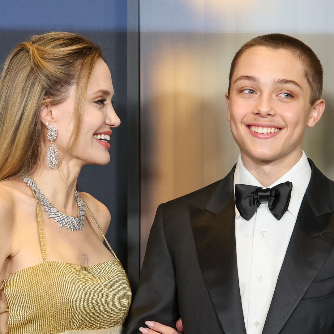 Knox Jolie Pitt looks strikingly like his parents as he buys groceries with a friend