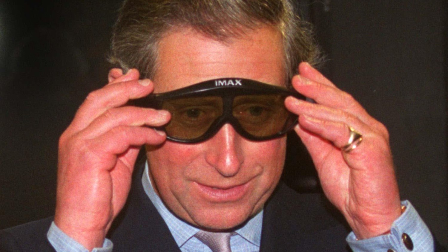 The then-Prince of Wales wears BFI IMAX glasses in 1999.