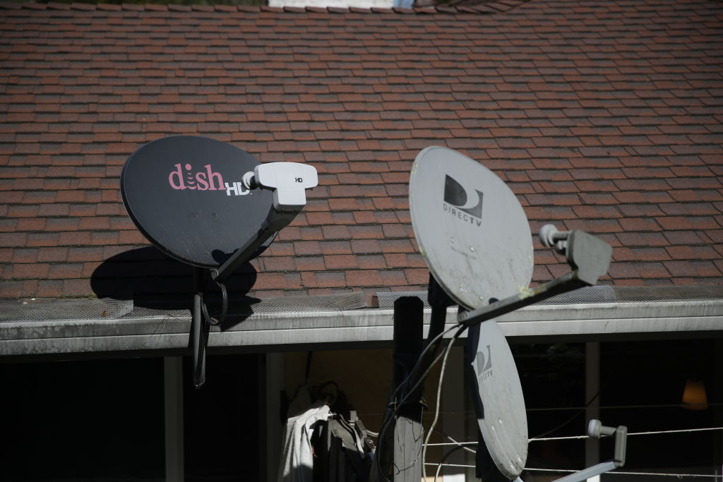 MILL VALLEY, CALIFORNIA - FEBRUARY 19:  A Dish Network satellite dish is mounted next to a DirecTV dish on the roof of an apartment building on February 19, 2020 in Mill Valley, California. Dish Network reported better-than-expected fourth quarter earnings with revenue of $3.24 billion compared to $3.31 billion one year ago. (Photo by Justin Sullivan/Getty Images)