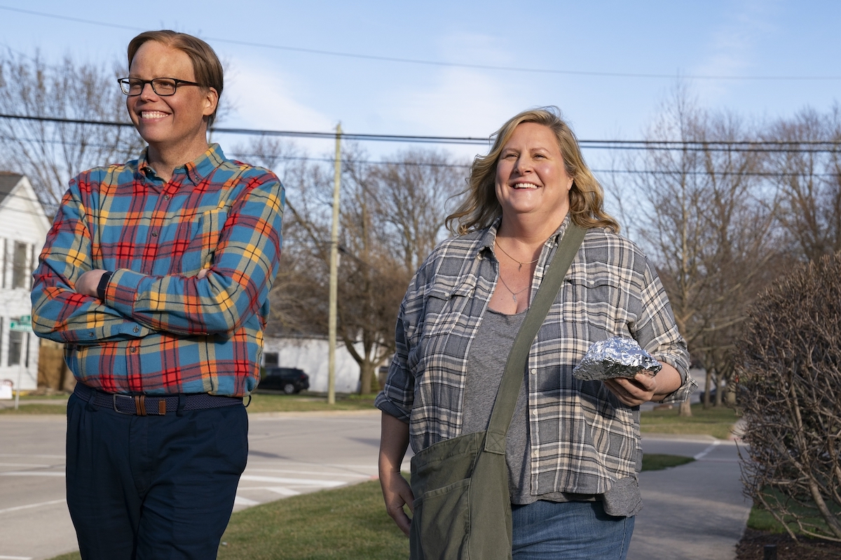 Jeff Hiller and Bridget Everett in 'Somebody Somewhere,' shown here walking down the sidewalk, smiling