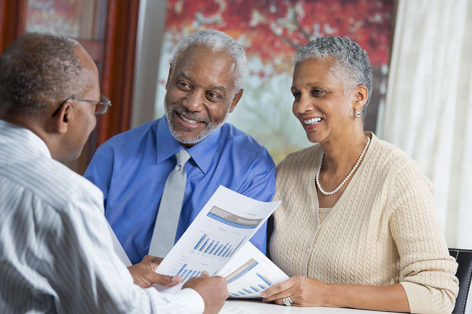 Couple talking to businessman about equipment financing