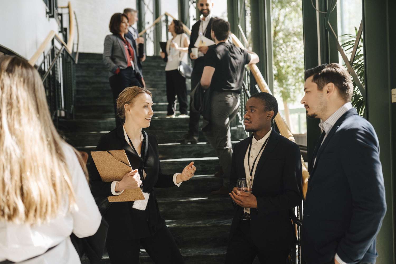 Economist and reporters meet in small groups outside a conference room where the Bureau of Economic Analysis will release GDP data.