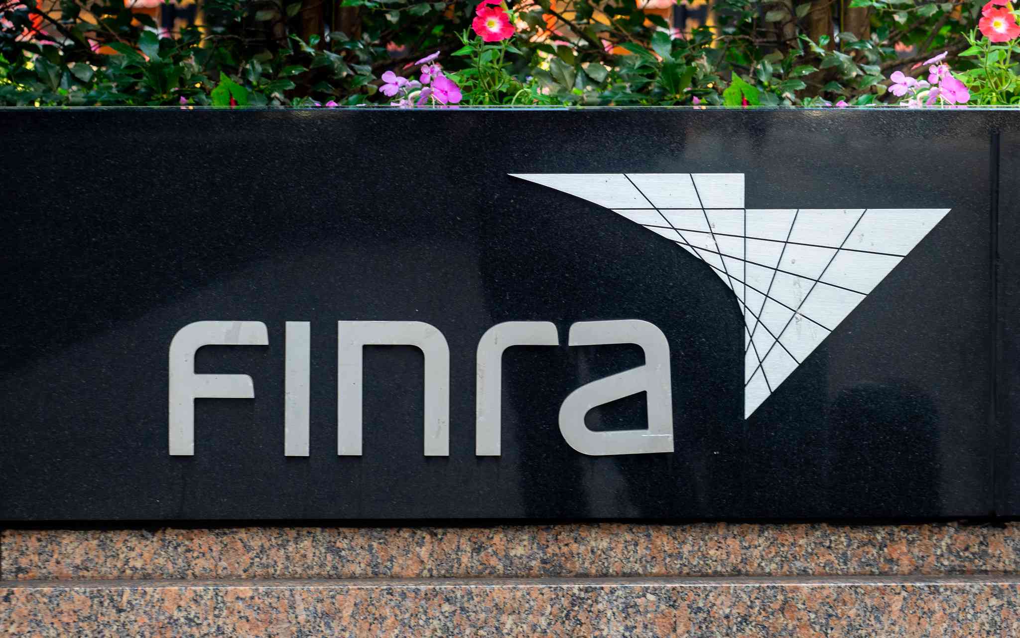 An outdoor sign that says FINRA