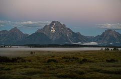 The Grand Tetons at sunrise at the Jackson Hole economic symposium in Moran, Wyoming. David Paul Morris / Bloomberg / Getty Images 