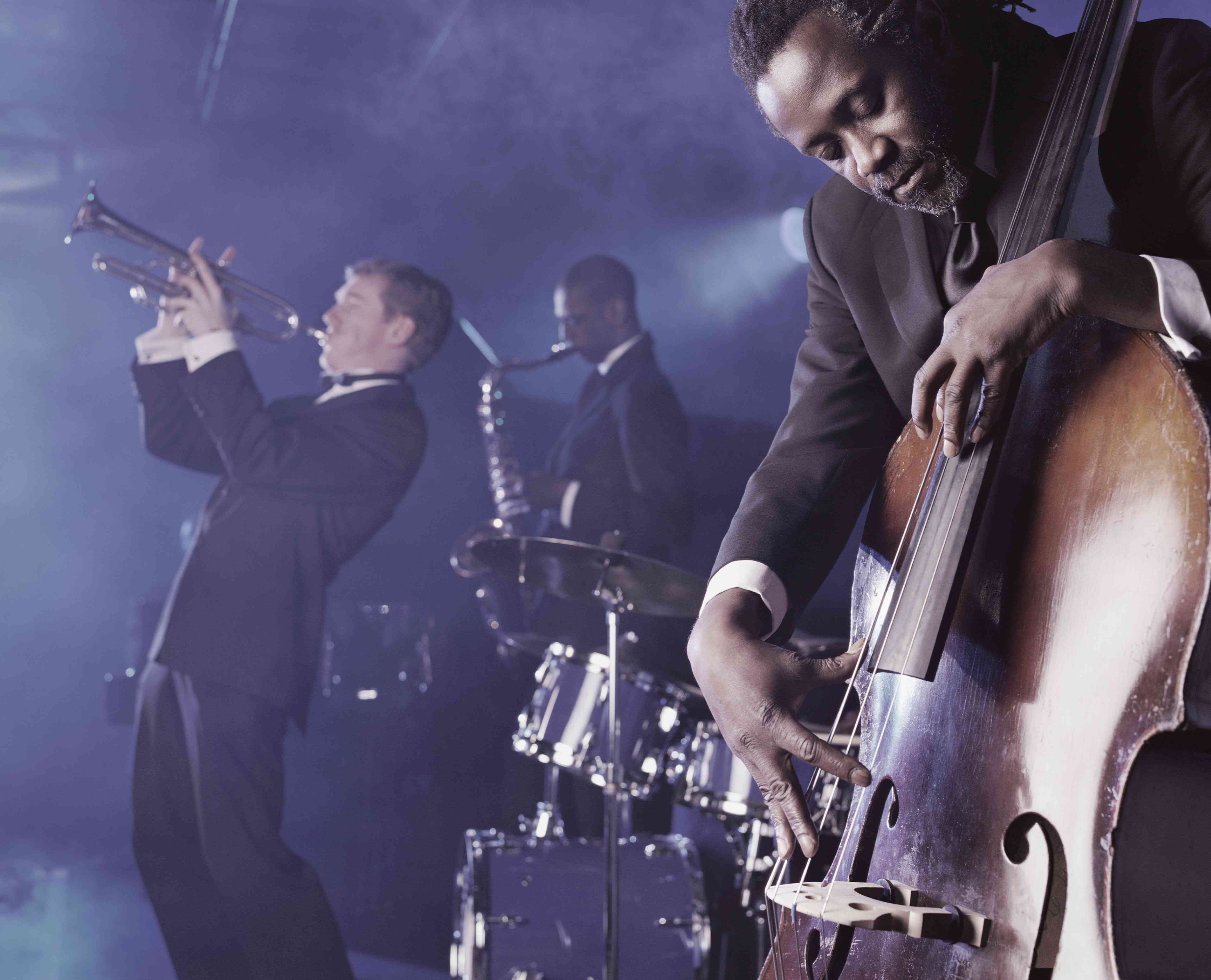 Jazz Band Playing Onstage in a Nightclub, Musician Plucking a Double Bass